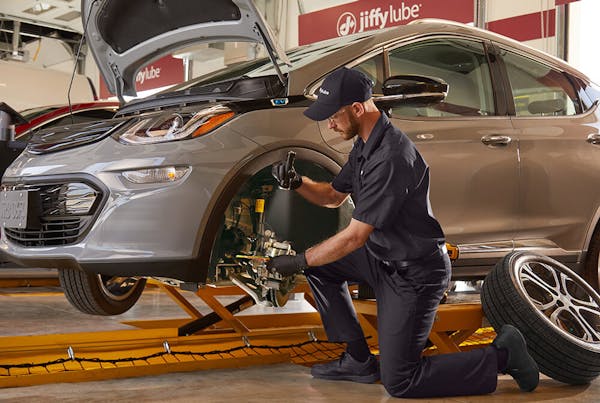 Jiffy Lube employee inspecting