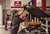 Jiffy Lube technician preparing to replace a customer