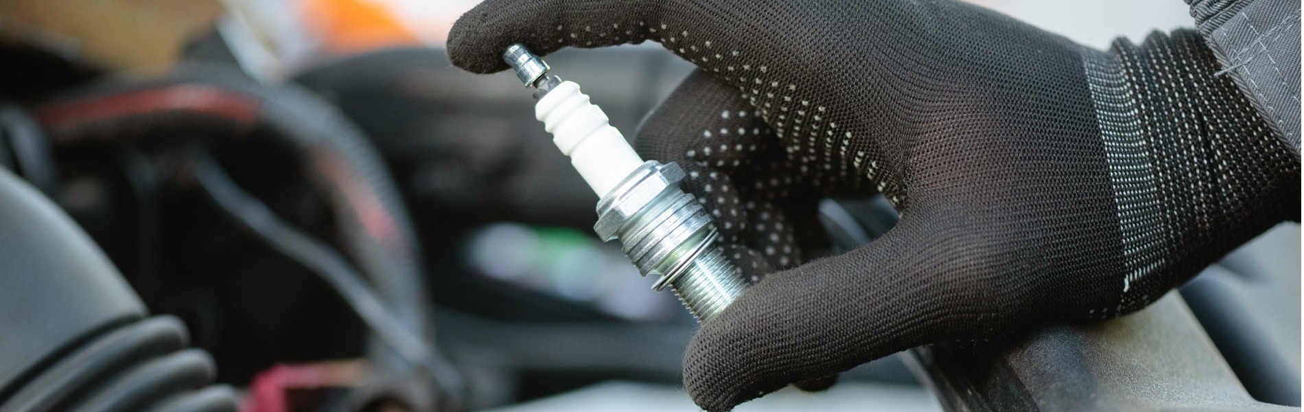 A close up of an engine tune up service being performed