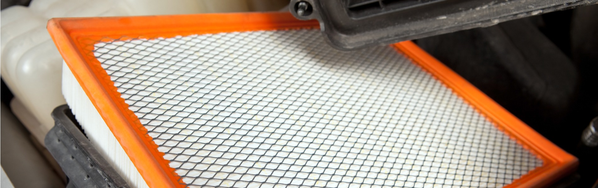 Close Up view of replacing an engine air filter