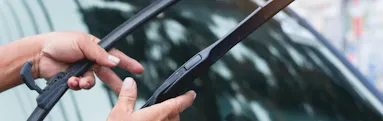 Mechanic replaces windshield wipers