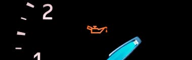 A close up of a vehicle's oil pressure  warning light
